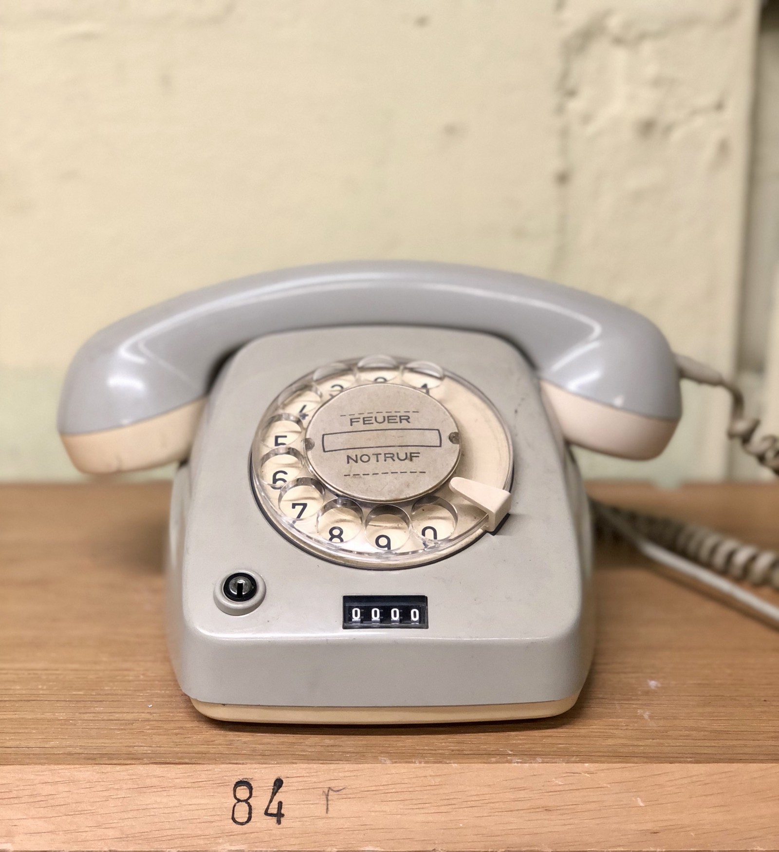 gray rotary telephone on brown table” by Eckhard Hoehmann on Unsplash